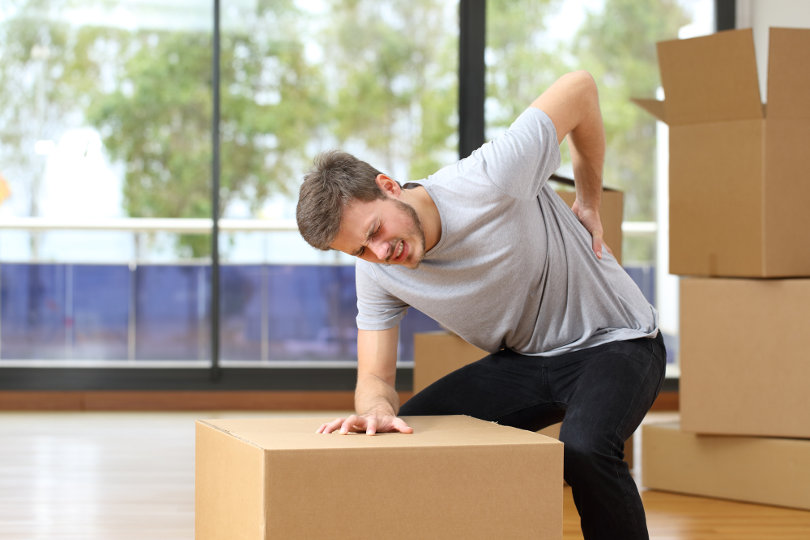 Suffering back injury when moving boxes at office